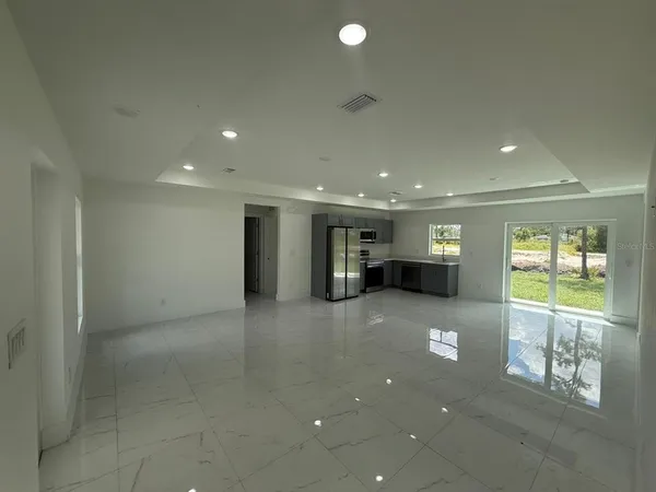 a bathroom with a shower sink and mirror