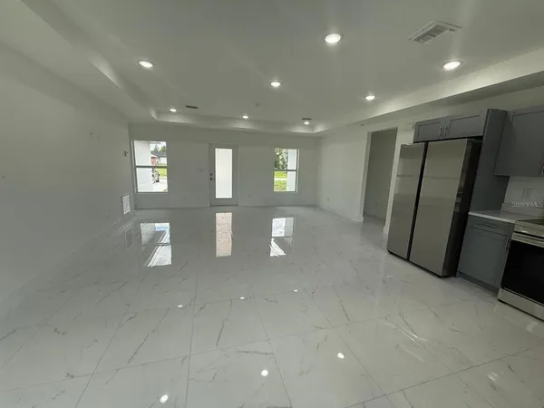 a view of a hallway with seating area