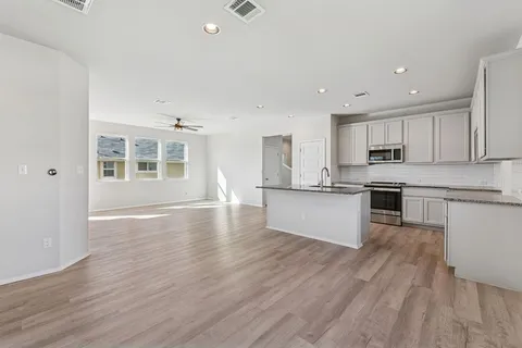 an aerial view of a city with lots of residential buildings