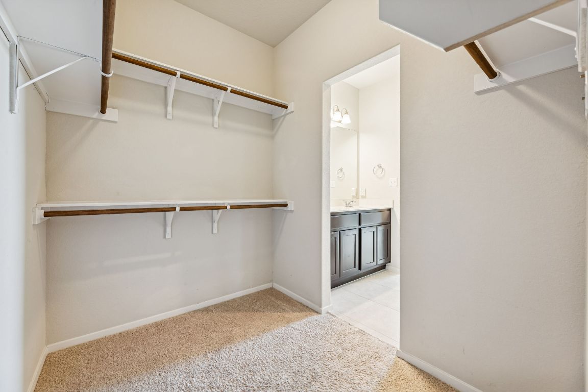 316 Insider Loop Elgin, TX 78621 - Photo 17 of 39 Walk in closet with light carpet