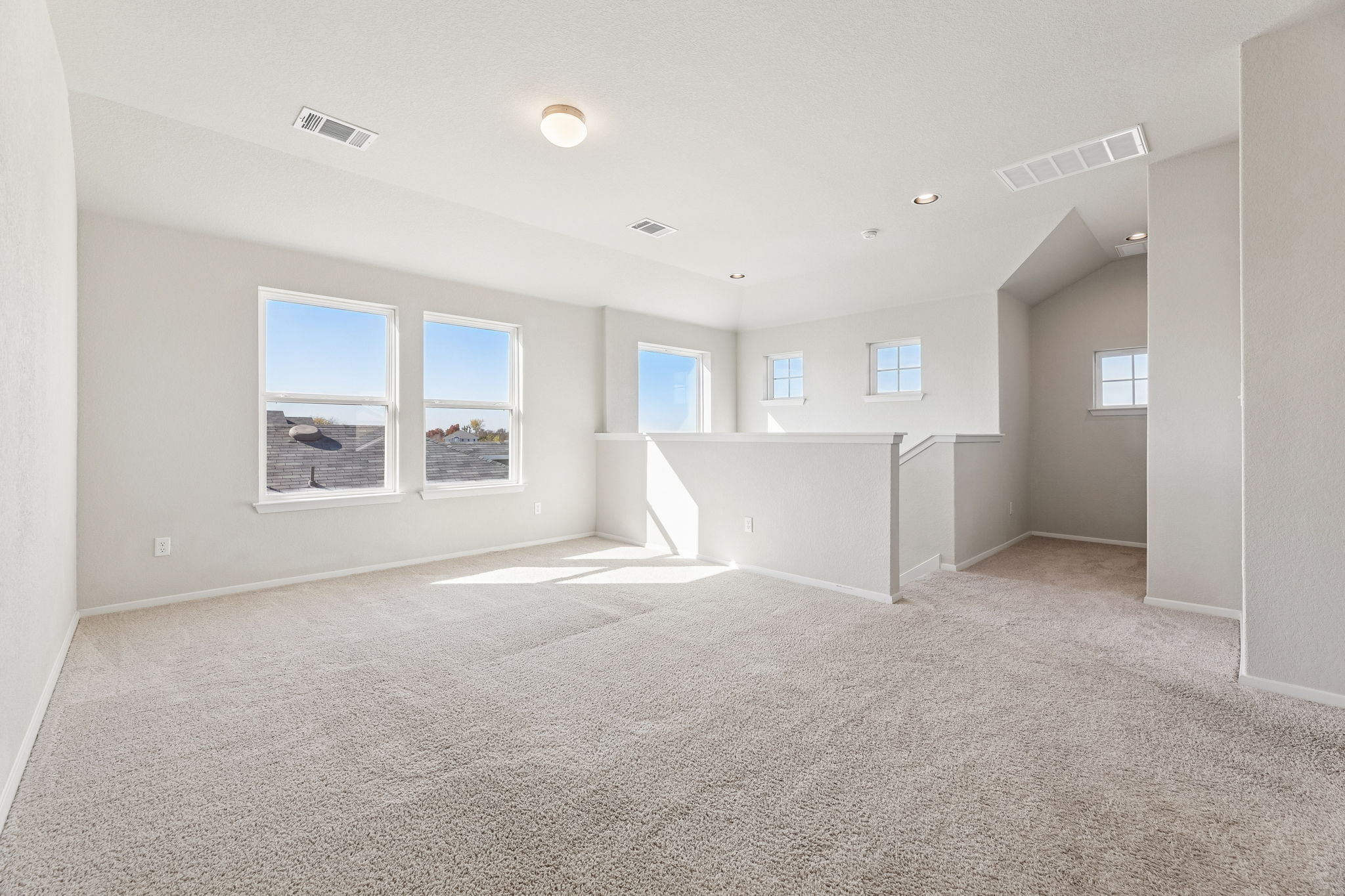 316 Insider Loop Elgin, TX 78621 - Photo 19 of 39 Unfurnished room with light colored carpet and recessed lighting