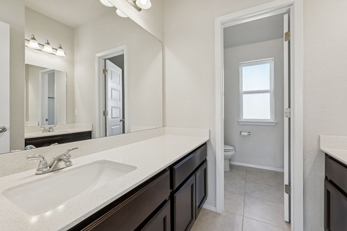 316 Insider Loop Elgin, TX 78621 - Photo 20 of 39 Full bath featuring vanity and light tile patterned flooring