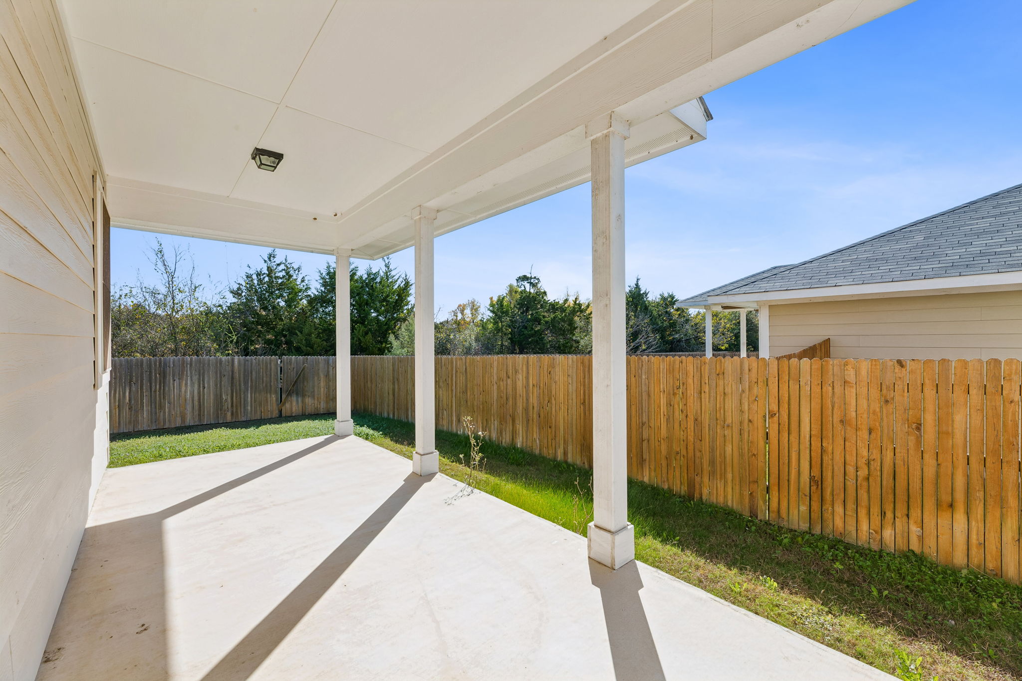 316 Insider Loop Elgin, TX 78621 - Photo 26 of 39 Fenced backyard featuring a patio area