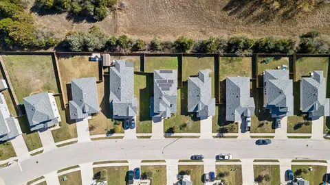 an aerial view of a house with a garden
