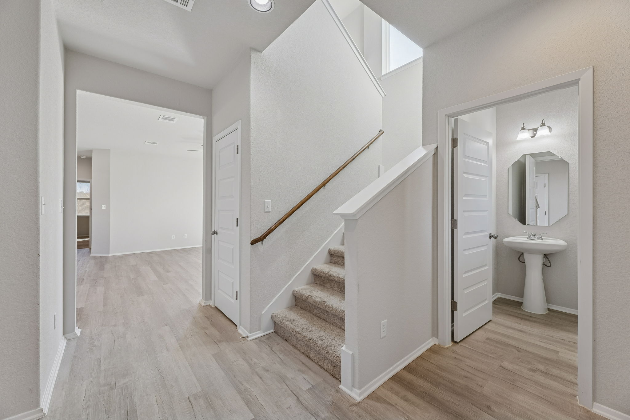 316 Insider Loop Elgin, TX 78621 - Photo 4 of 39 Stairway featuring wood finished floors