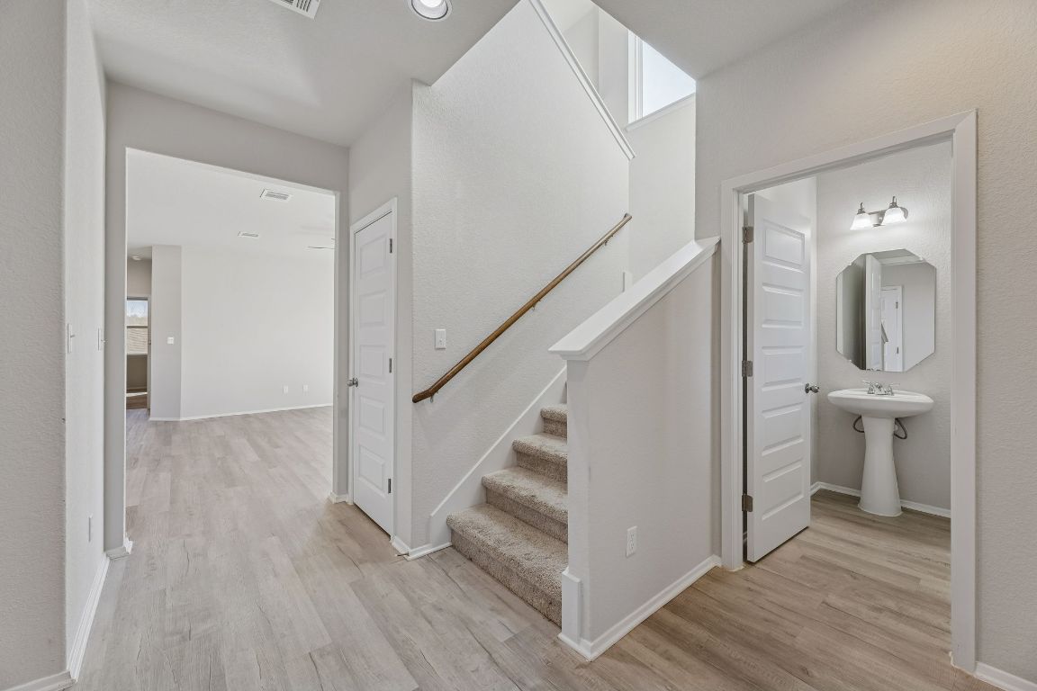 316 Insider Loop Elgin, TX 78621 - Photo 4 of 39 a view of bathroom with a sink and toilet