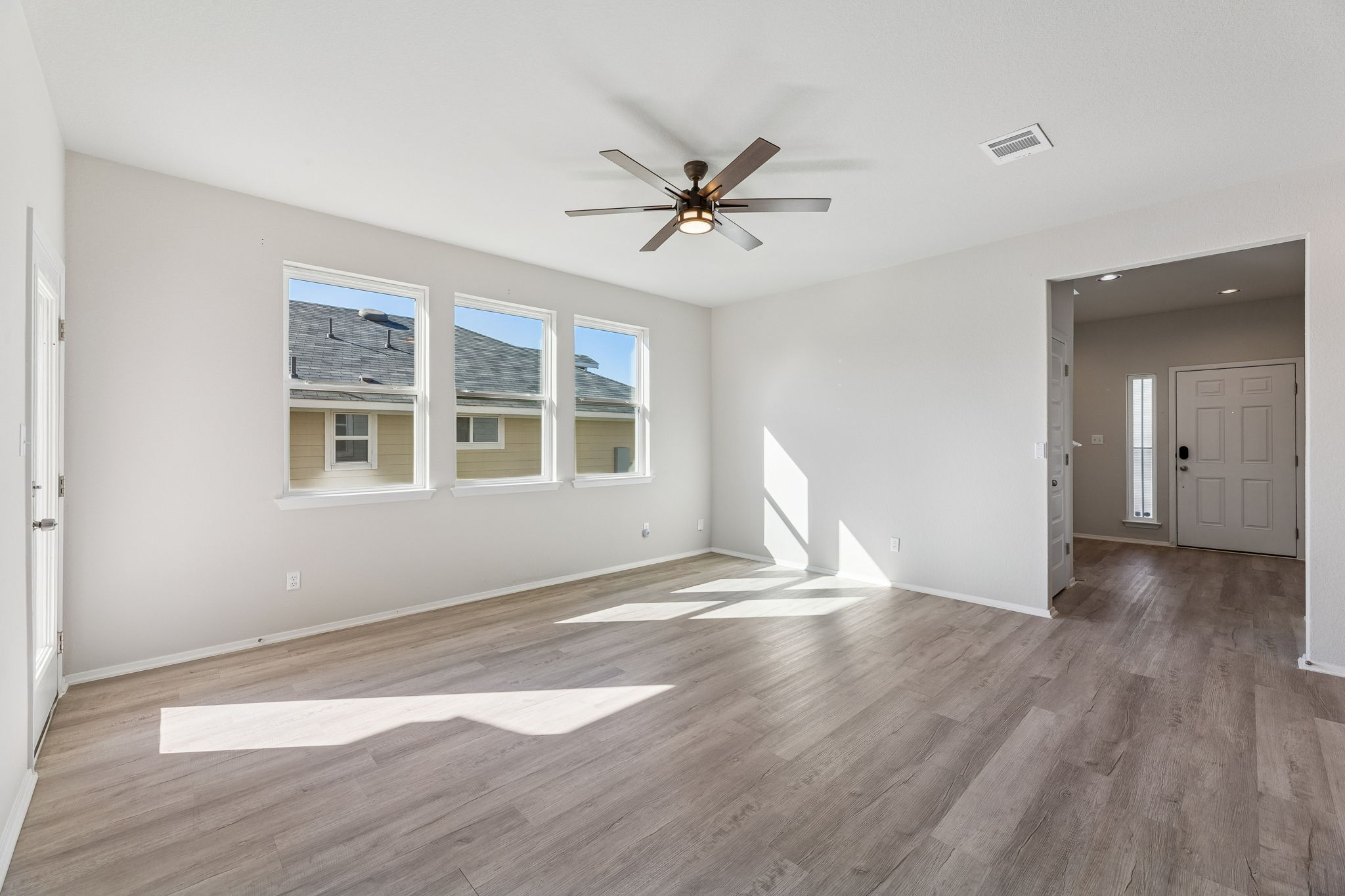 316 Insider Loop Elgin, TX 78621 - Photo 9 of 39 Spare room featuring light wood-style flooring and ceiling fan
