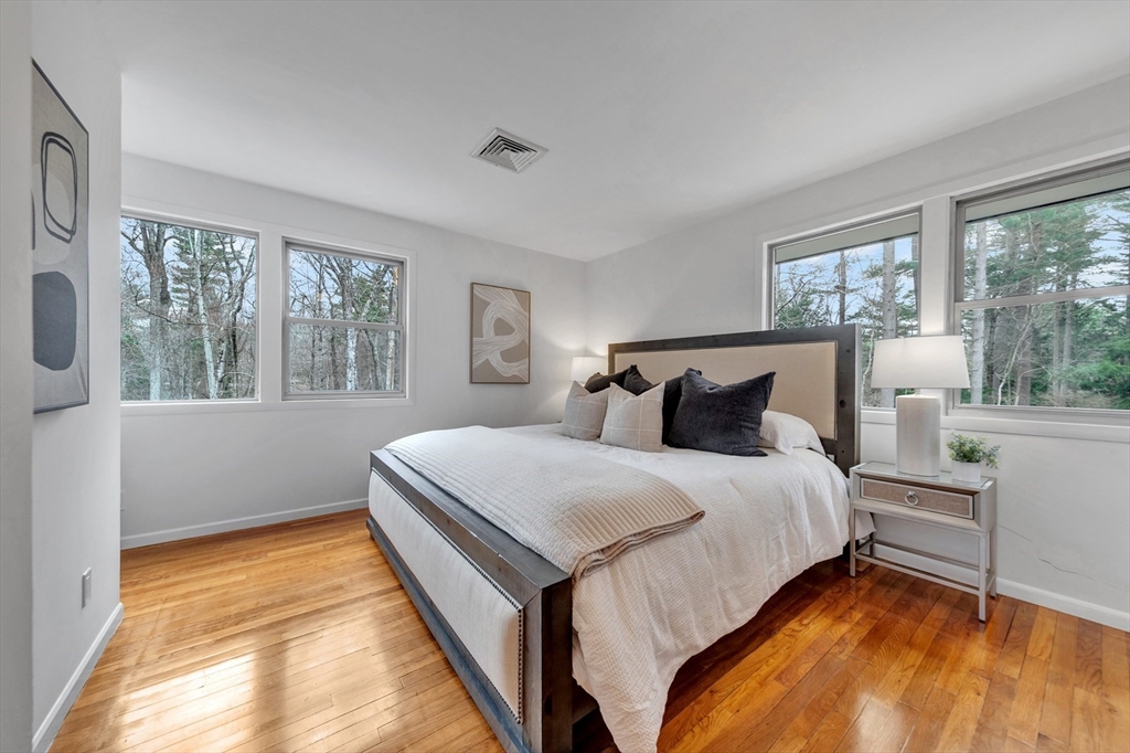 85 The Valley Road Concord, MA 01742 - Photo 20 of 38 a bedroom with a bed and window