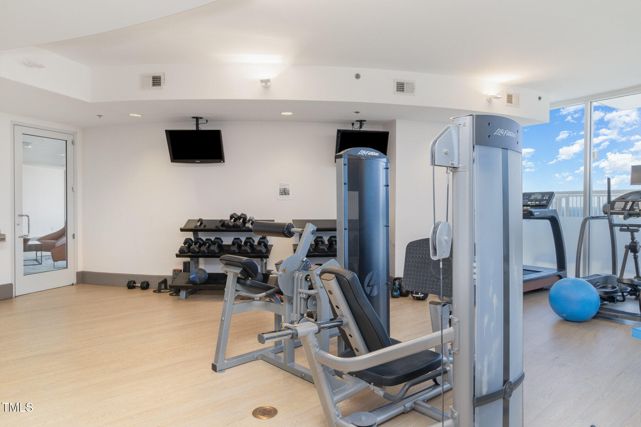 301 Fayetteville Street, Unit 2701 Raleigh, NC 27601 - Photo 19 of 26 a view of a room with gym equipment