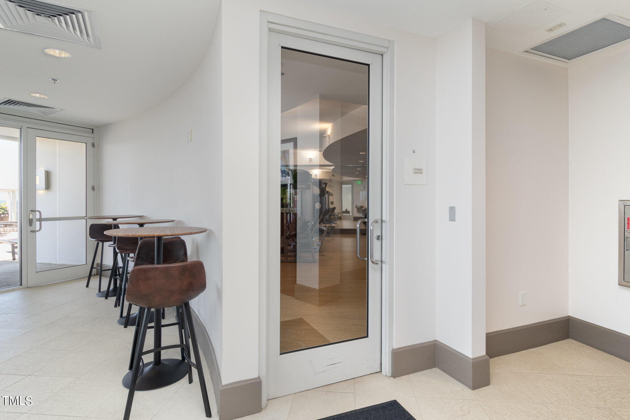 301 Fayetteville Street, Unit 2701 Raleigh, NC 27601 - Photo 20 of 26 a view of a hallway to a livingroom and furniture