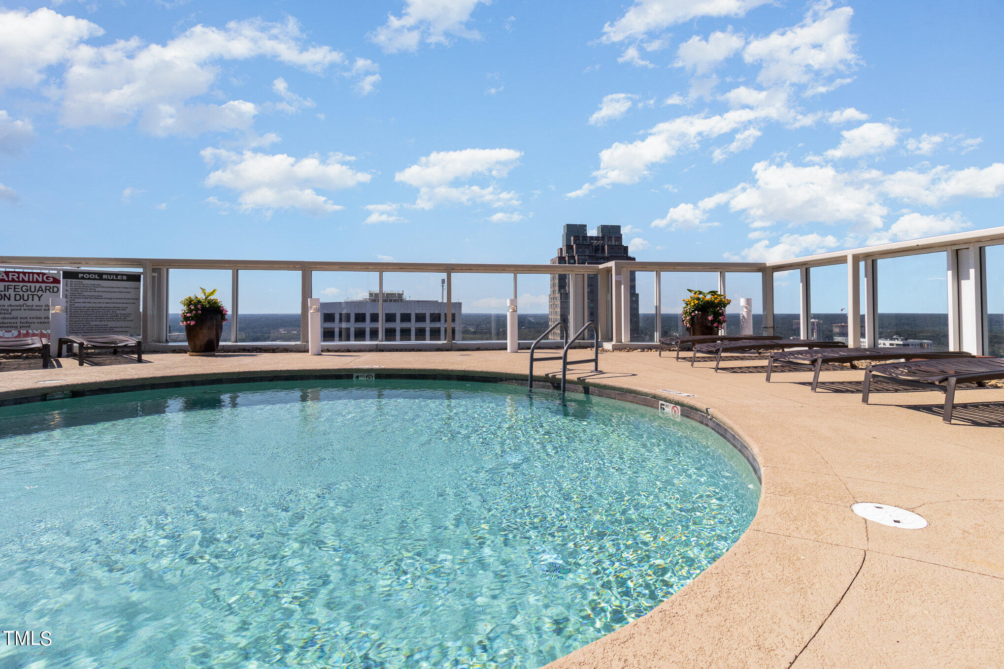 301 Fayetteville Street, Unit 2701 Raleigh, NC 27601 - Photo 23 of 26 a swimming pool with outdoor seating and yard
