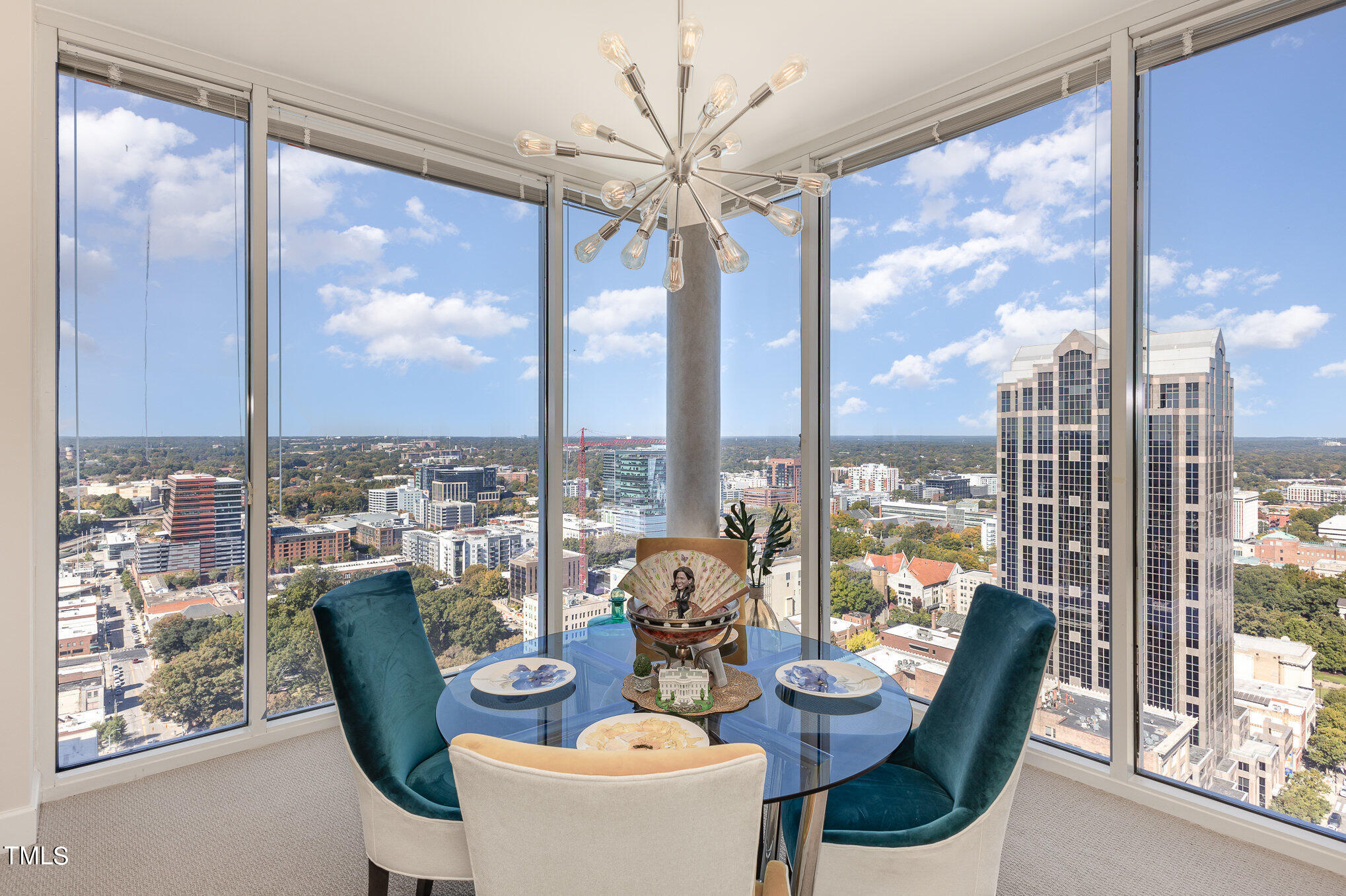 301 Fayetteville Street, Unit 2701 Raleigh, NC 27601 - Photo 6 of 26 a dining room with furniture water view and a large window