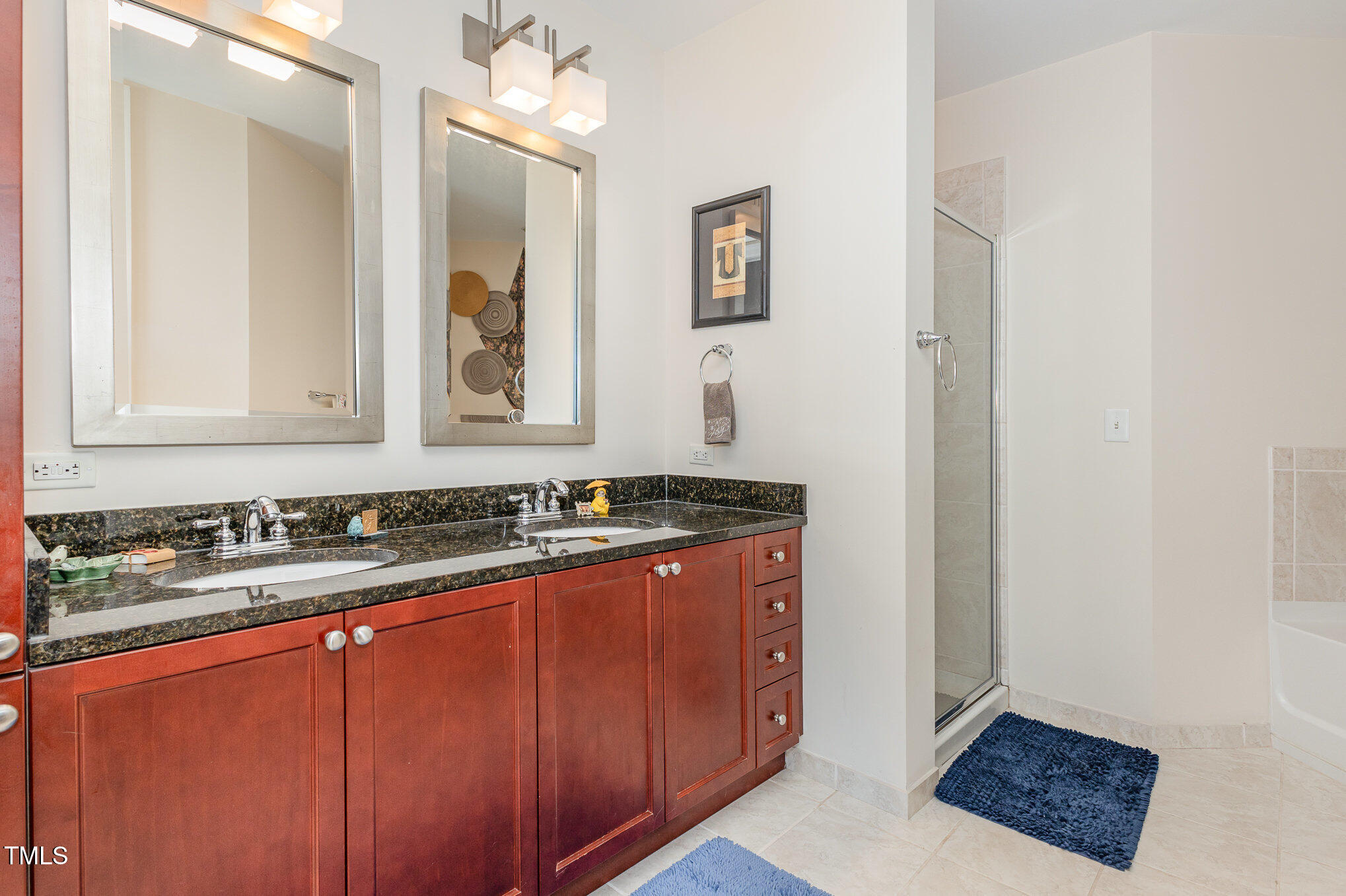 301 Fayetteville Street, Unit 2701 Raleigh, NC 27601 - Photo 9 of 26 a bathroom with a sink and a mirror