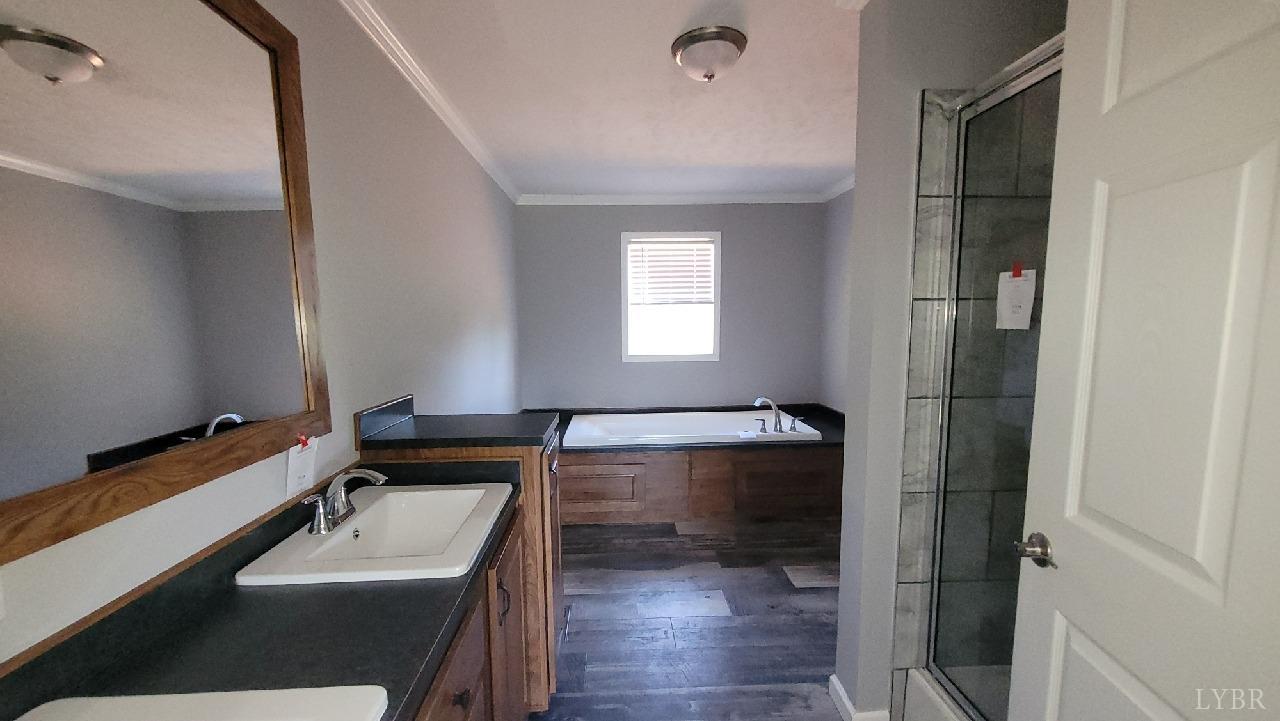 414 Loman Road Meherrin, VA 23954 - Photo 16 of 16 a bathroom with a sink and a mirror