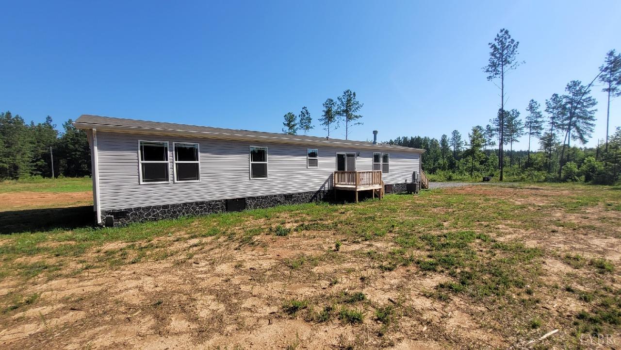 414 Loman Road Meherrin, VA 23954 - Photo 2 of 16 a view of a house with backyard and sitting area