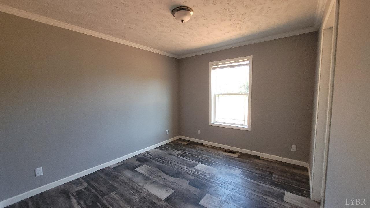 414 Loman Road Meherrin, VA 23954 - Photo 10 of 16 a view of a room with wooden floor and windows