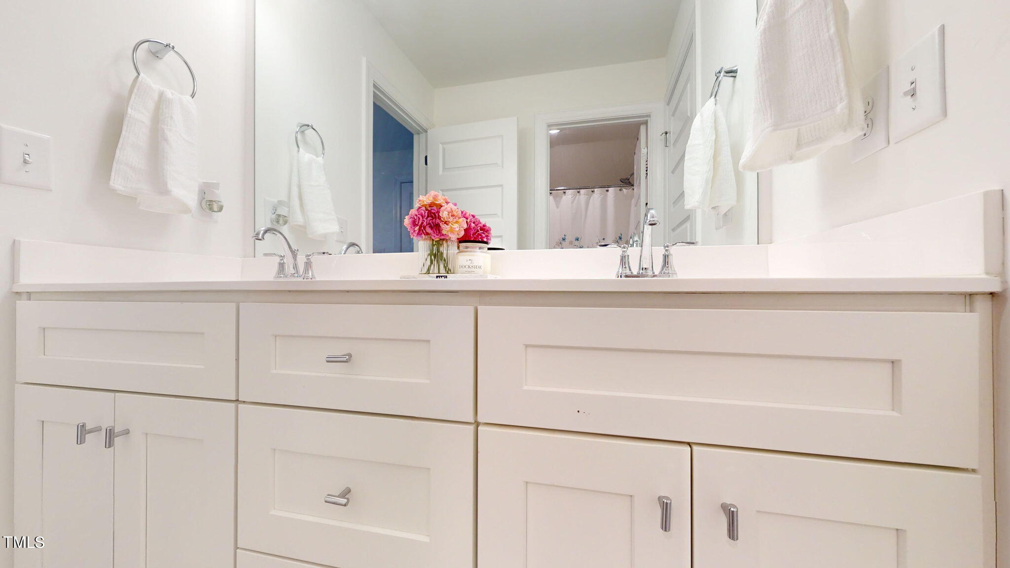 3000 New Watkins Lane Raleigh, NC 27616 - Photo 27 of 33 a bathroom with a sink and a mirror
