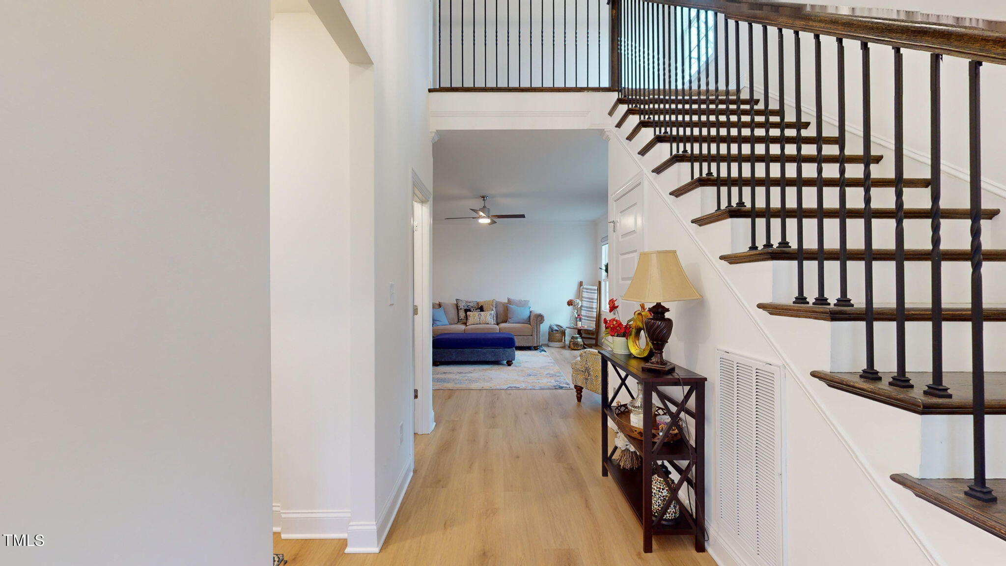 3000 New Watkins Lane Raleigh, NC 27616 - Photo 8 of 33 a view of a hallway with wooden floor and staircase