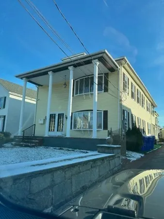 a view of house with yard