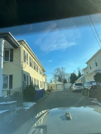 a view of a big house with a big yard