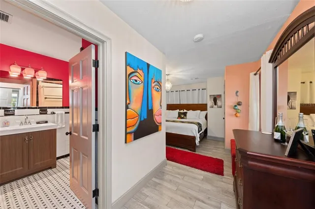 a kitchen with stainless steel appliances granite countertop a sink and a refrigerator