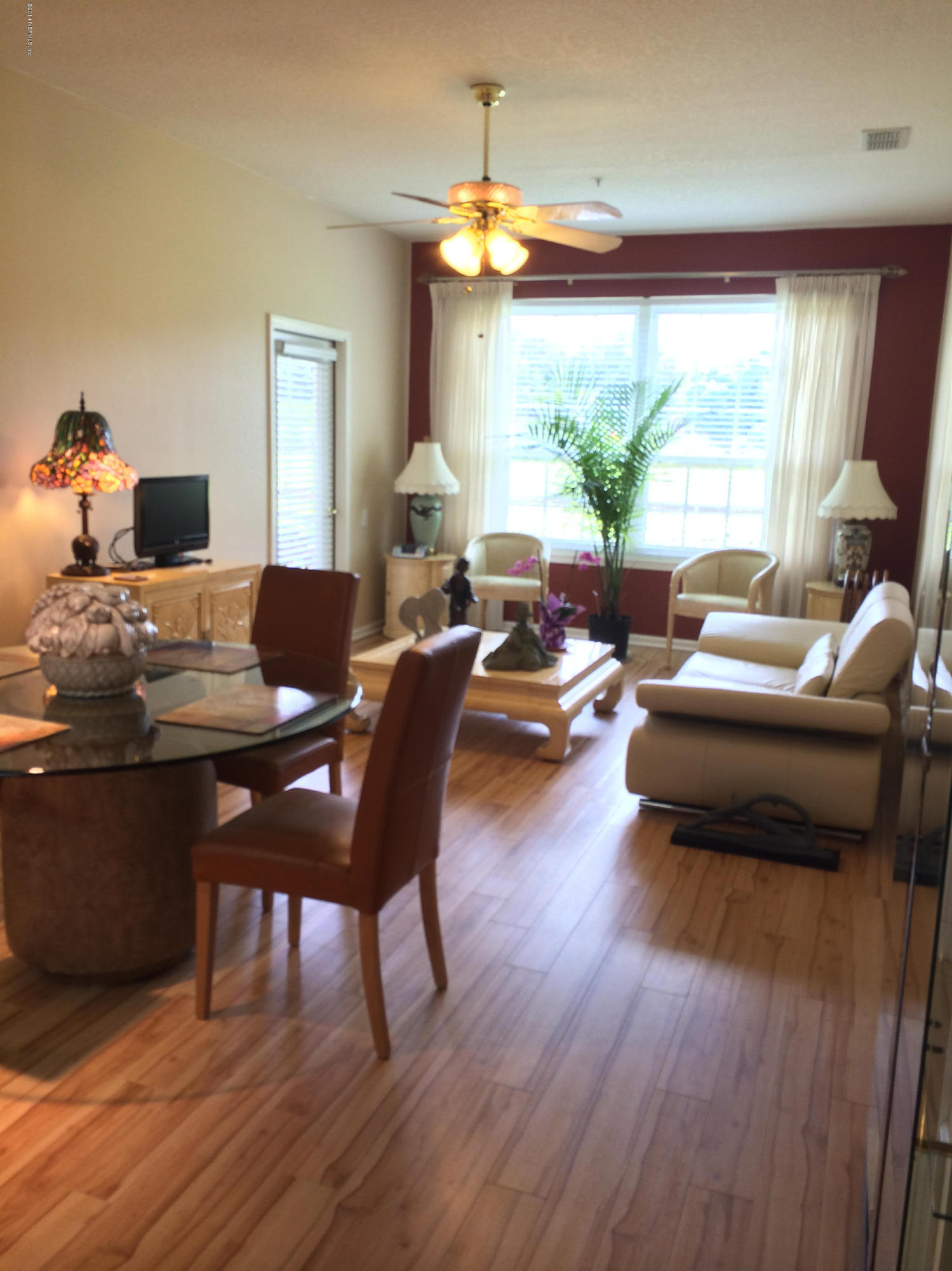 10550 Baymeadows Road, Unit 704 Jacksonville, FL 32256 - Photo 3 of 14 Living Room overlooking the lake