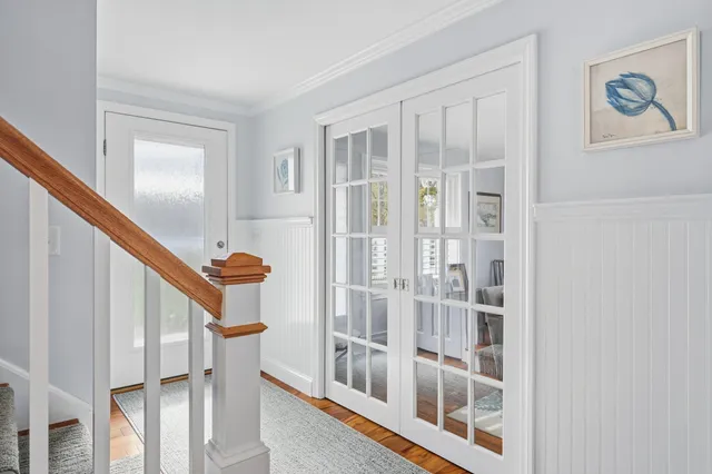 a view of an entryway with wooden floor