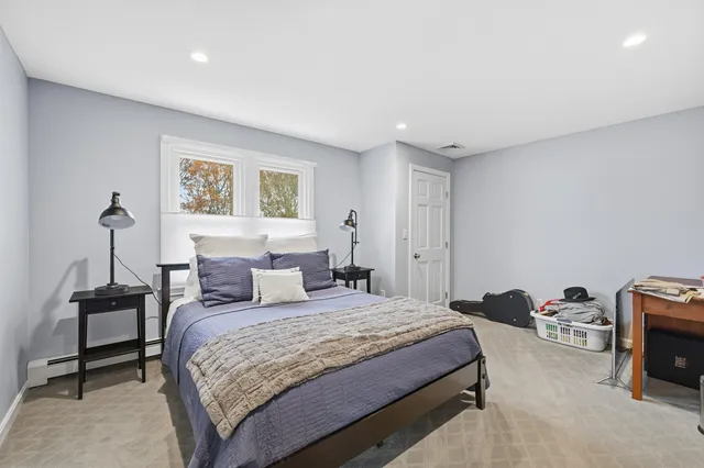 a bathroom with a granite countertop sink mirror and bathtub