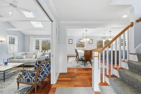 a kitchen with stainless steel appliances granite countertop a sink a stove and a refrigerator