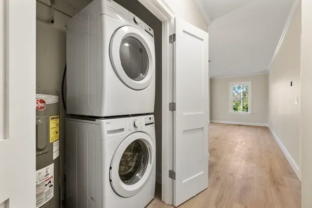 a view of a hallway with washer and dryer
