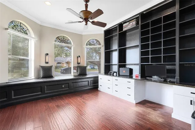 a living room with hard wood floors and a wooden floors