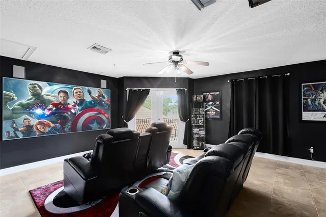a living room with furniture a rug and wall painting
