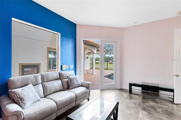 a living room with furniture and a window