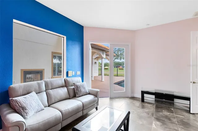 a living room with furniture and a window