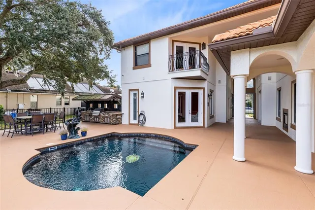 a view of a house with swimming pool