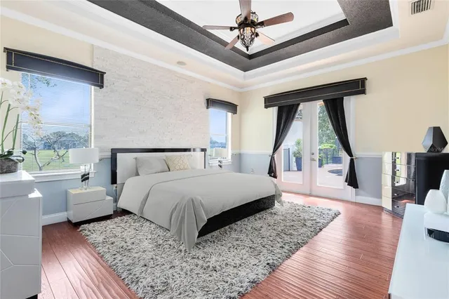 a bedroom with a large bed and a large window