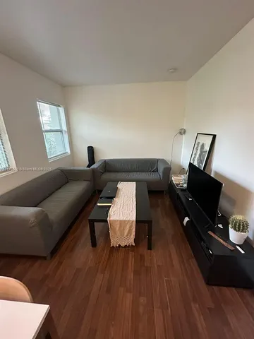 a kitchen with a table and chairs