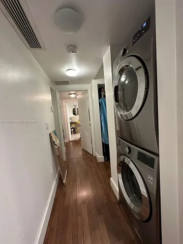 a bedroom with a bed a dresser and a ceiling fan