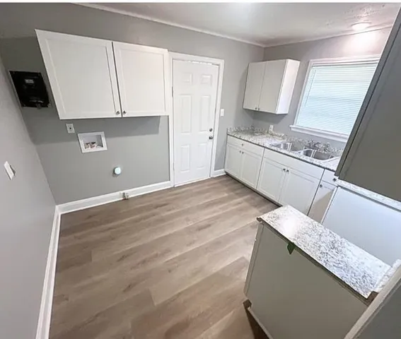 a view of cabinets and wooden floor