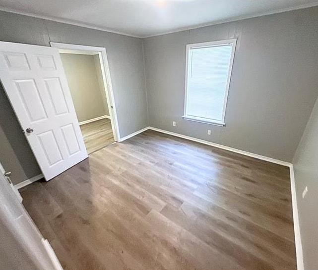 3101 Sunrise Street Memphis, TN 38127 - Photo 5 of 7 an empty room with wooden floor and window