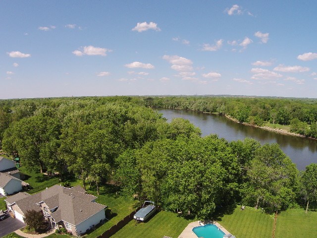 10919 Chicory Ridge Way Roscoe, IL 61073 - Photo 3 of 25 a view of a lake with houses in the back