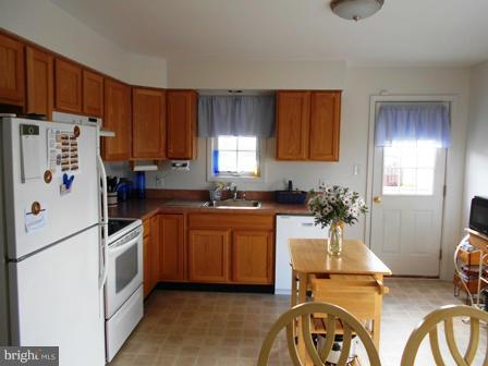 26 Robelei Drive Ranson, WV 25438 - Photo 3 of 18 a kitchen with a refrigerator and a sink