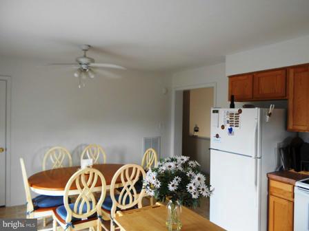 26 Robelei Drive Ranson, WV 25438 - Photo 4 of 18 a white kitchen with a refrigerator and a sink