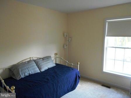 26 Robelei Drive Ranson, WV 25438 - Photo 9 of 18 a bedroom with a bed and window