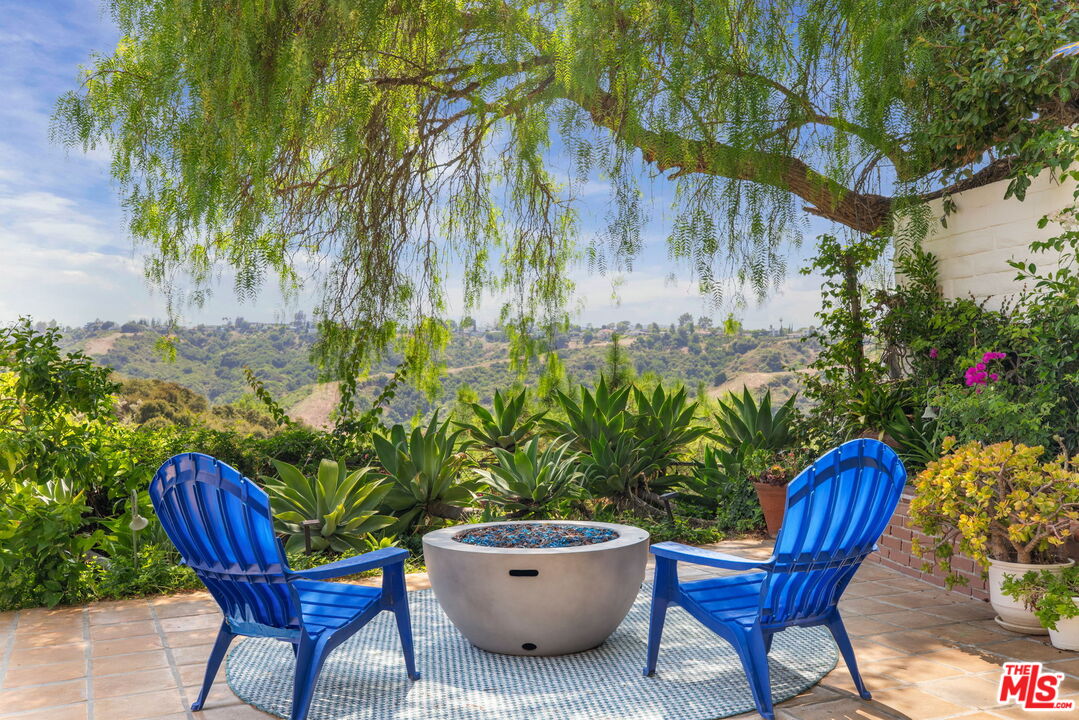 2829 Bottlebrush Drive Los Angeles, CA 90077 - Photo 1 of 40 a view of a backyard with plants and chairs
