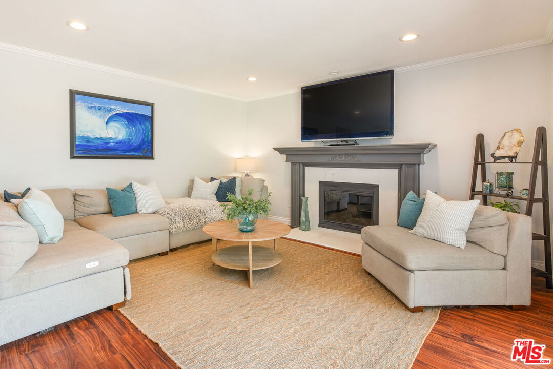 2829 Bottlebrush Drive Los Angeles, CA 90077 - Photo 13 of 40 a living room with furniture and a fireplace