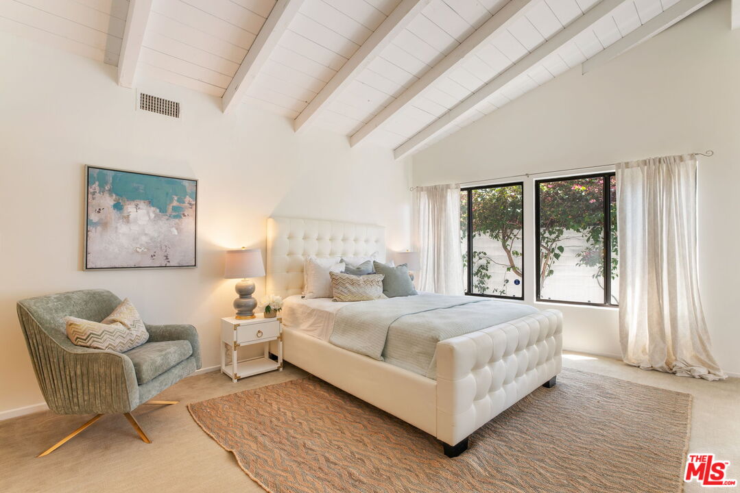 2829 Bottlebrush Drive Los Angeles, CA 90077 - Photo 15 of 40 a bedroom with a bed and a large window