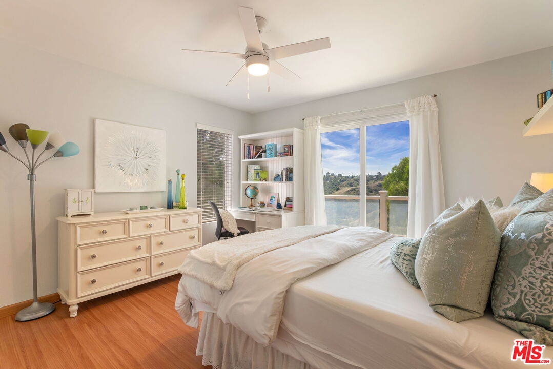 2829 Bottlebrush Drive Los Angeles, CA 90077 - Photo 20 of 40 a spacious bedroom with a bed and a dresser