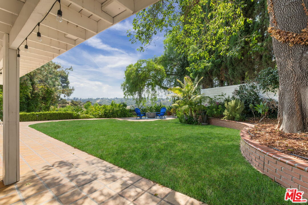2829 Bottlebrush Drive Los Angeles, CA 90077 - Photo 27 of 40 a view of a garden with a fountain