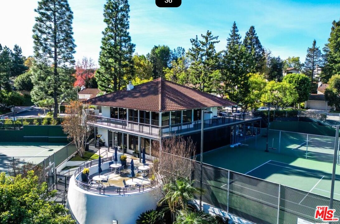 2829 Bottlebrush Drive Los Angeles, CA 90077 - Photo 39 of 40 a front view of a house with swimming pool and sitting area